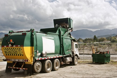 Waste disposal trucks handling construction debris